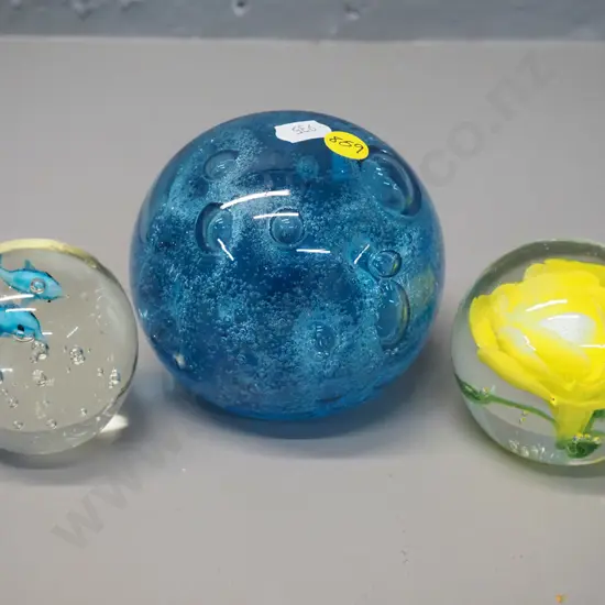 3 glass paperweights - largest is D-100