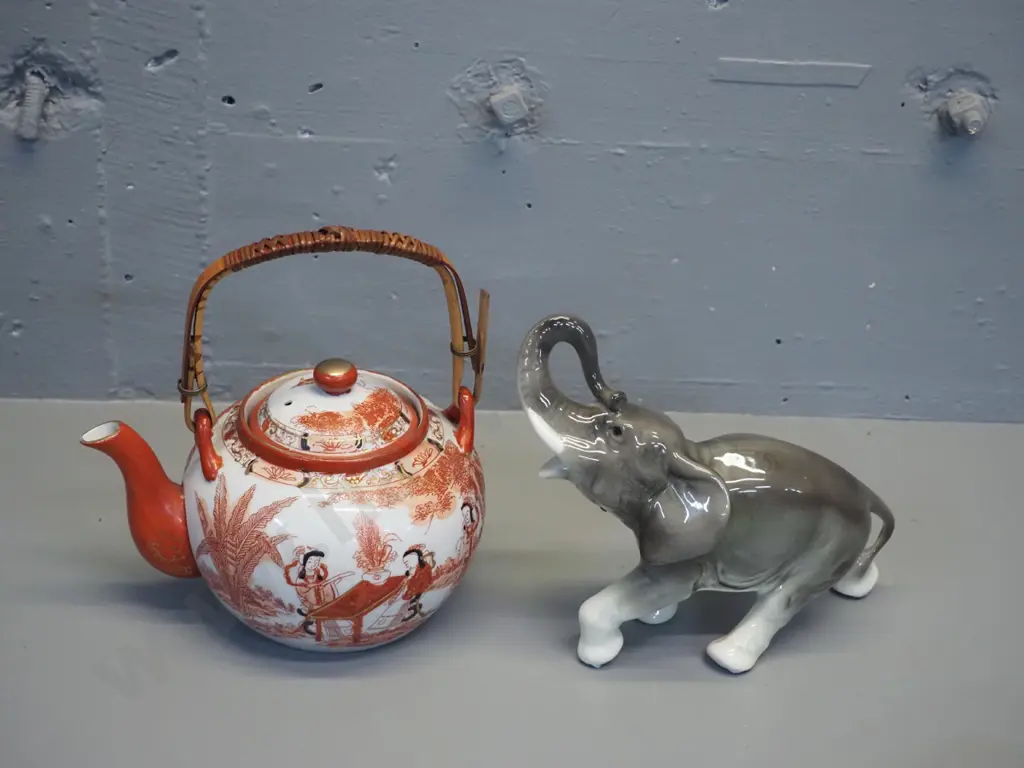 asian Kutani style teapot with strainer and cane handle, small chips to rim, and a porcelain elephant figurine H170 L200 Image 1++