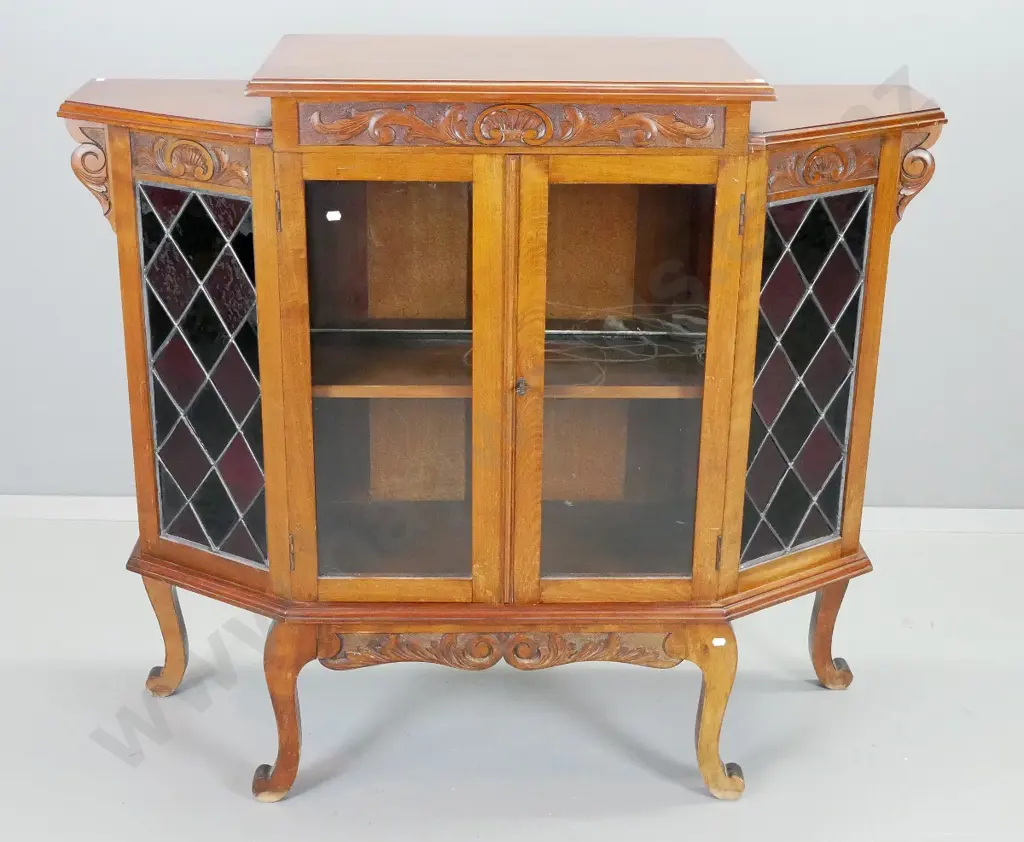 Edwardian kauri & beech parlour cab leg display cabinet with carved frieze, 2 glazed cupboard doors, coloured glass Image 1++