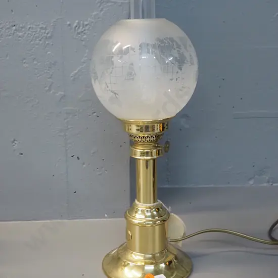 Harnisch Denmark reproduction brass table lamp in style of kerosene lamp, with frosted world map themed shade, clear