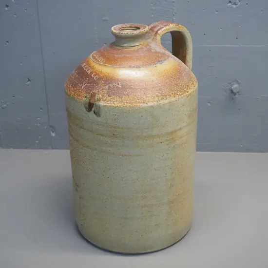 large handled narrow-mouth stoneware crock marked Dominion Fertiliser Co Dunedin - Poison H-430 D-260