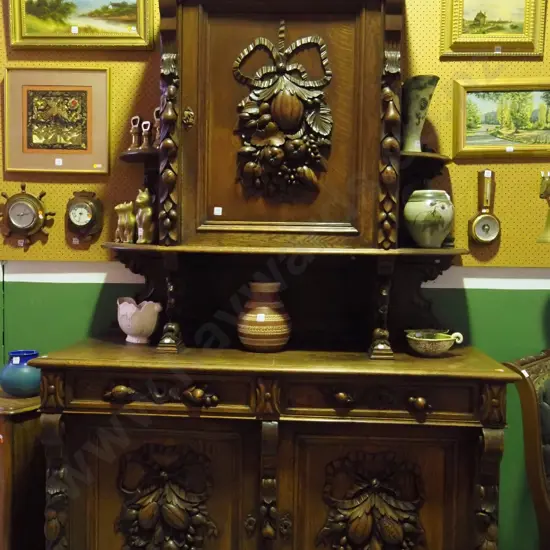 large 3-door 2-drawer northern European carved oak sideboard w/ central dome shaped cornice over cupboard door, semi-