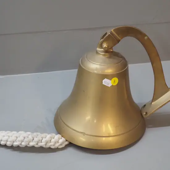 large brass wall-mount bell with corded clapper 'handle' H140 D-180