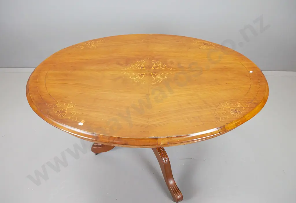oval walnut loo table with boxwood inlays on tilting top mechanism, pedestal base with three scrolling legs Image 1++