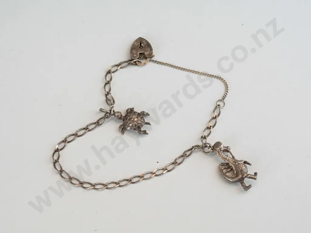 silver charm bracelet with turtle & dragon charm  & satety chain  stamped 925 Image 1++