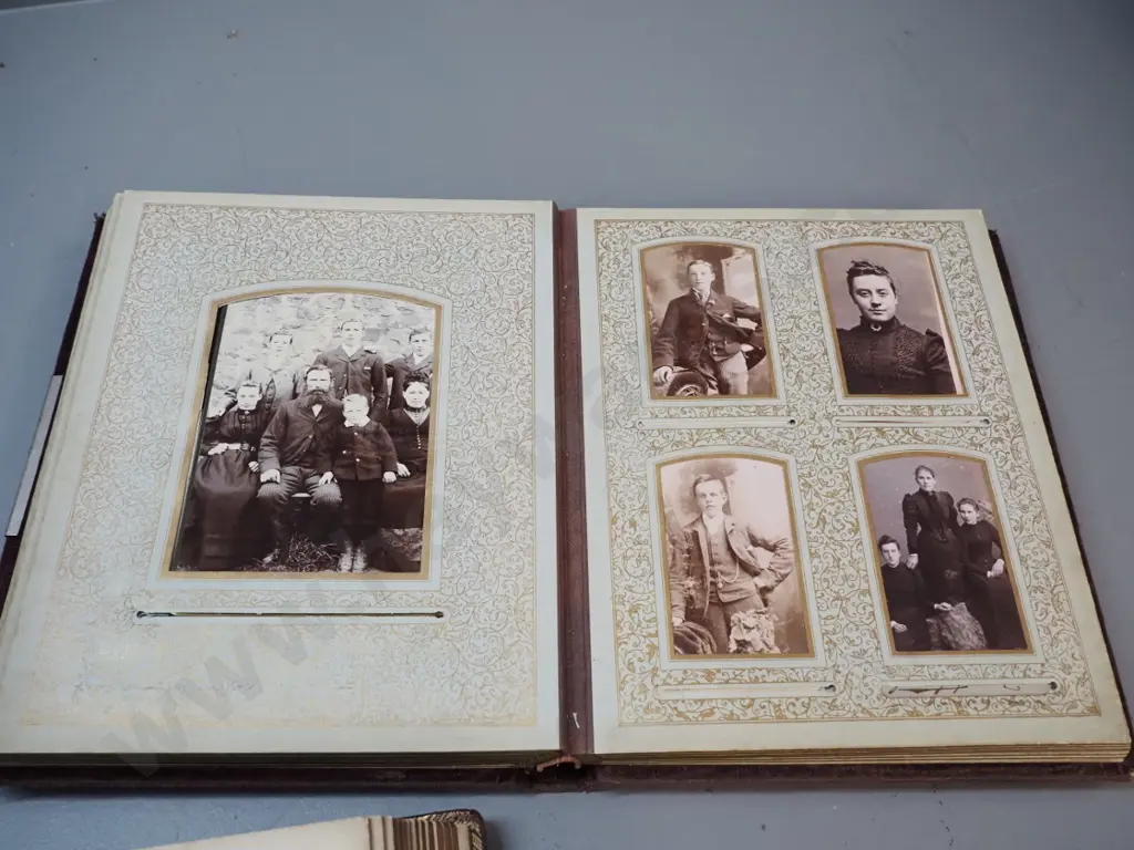 2 antique photo albums with numerous portrait & group photographs, some loose photos and memorial cards. Both missing Image 1++