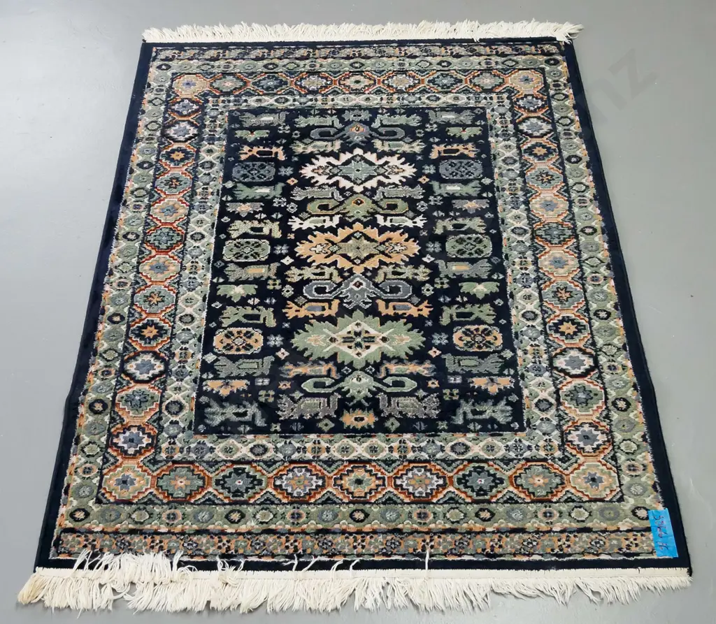 rug in green and blue ground, central medallion of geometric design, multiple geometric borders Image 1++