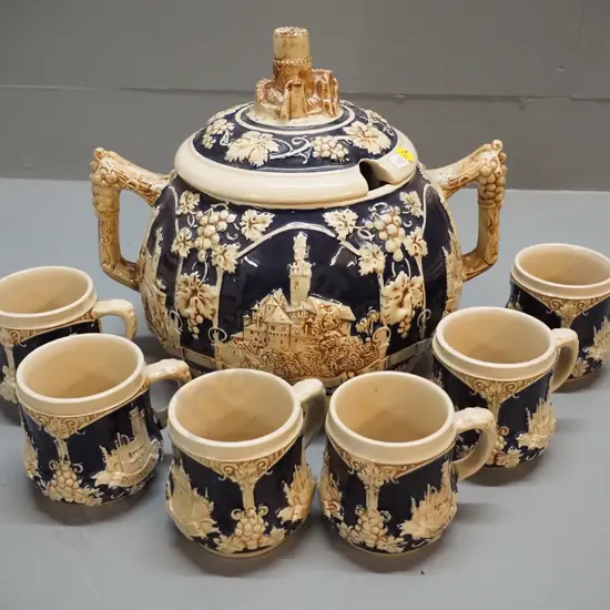 raised-motif navy and cream colour lidded rum pot and 6 mugs - marked 'Made in Western Germany' Pot H280 W300