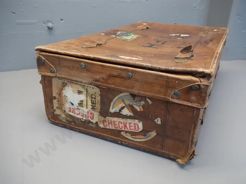 vintage leather suitcase with brass studding, travel label fragments, label inside: made by Pikah Leather Products Hong Image 1++