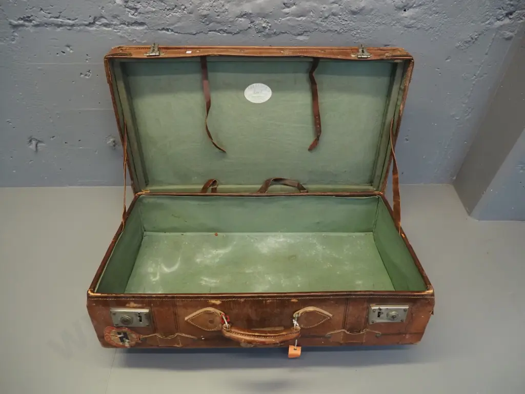 vintage leather suitcase with brass studding, travel label fragments, label inside: made by Pikah Leather Products Hong Image 1++