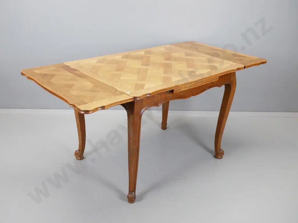 French oak draw leaf table with parquetry inlay top and tapered scrolling legs, H-740, W- 1000, D- 750 Image 1++