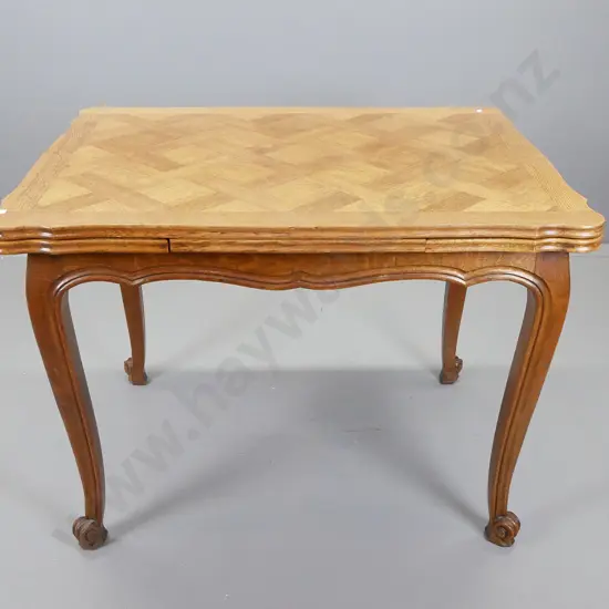 French oak draw leaf table with parquetry inlay top and tapered scrolling legs, H-740, W- 1000, D- 750