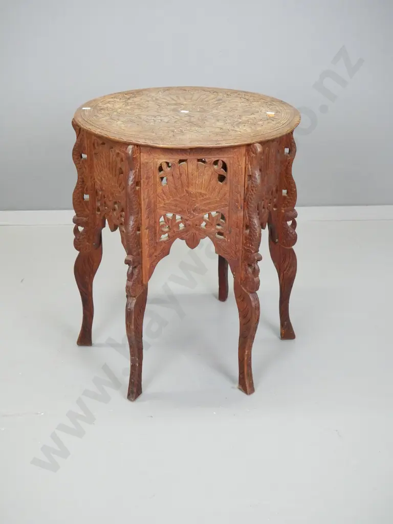 Indian hardwood heavily carved 6-legged occasional table with bird and foliage decoration - worn finish on top, chips to Image 1++
