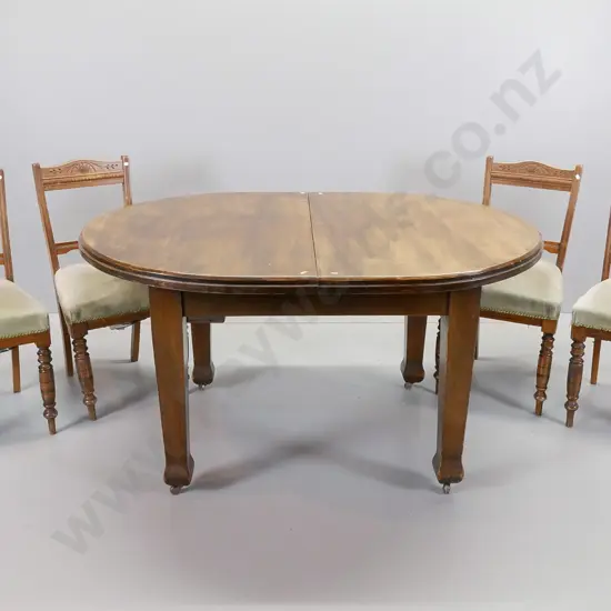 vintage oval oak extending table with four beech turned leg, green upholstered dining chairs