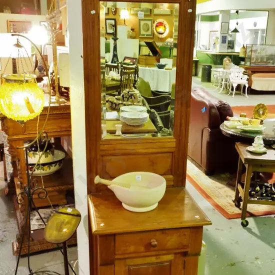 reproduction hall stand with bevelled edge mirror, 2 brass coat hooks, 1 drawer, 1 door w/ wooden knobs
