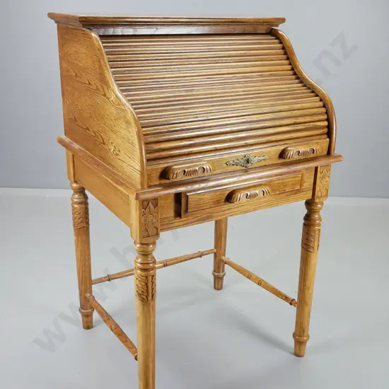 reproduction oak small roll-top desk with lower divided drawer, interior pigeonholes and drawers w/ brass hardware,