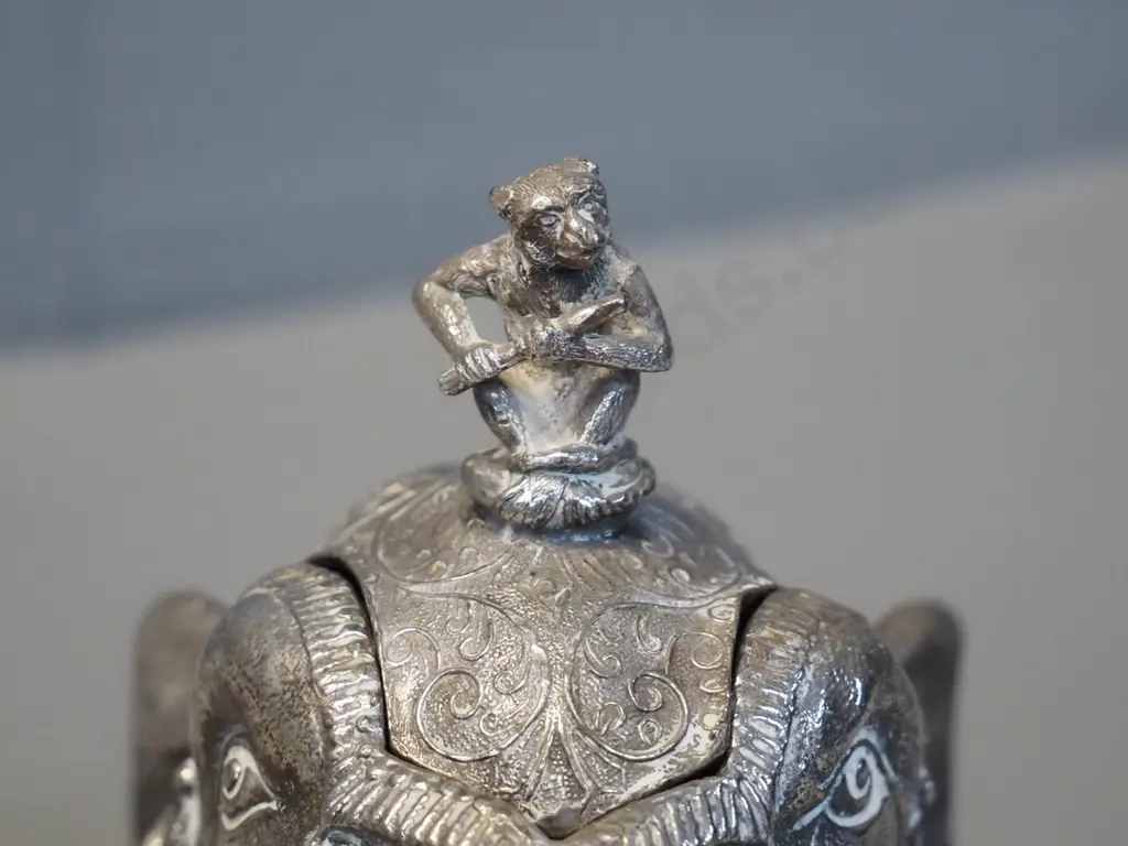 silver plated Indian style elephant head inkwell with monkey playing flute on lid, marked Meriden USA, damage to hinge, Image 1++