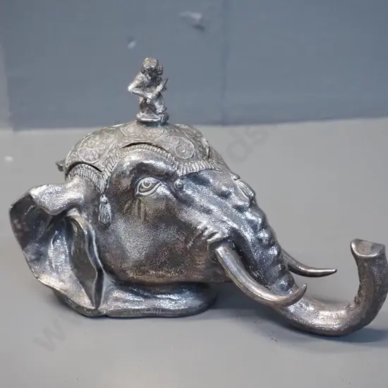 silver plated Indian style elephant head inkwell with monkey playing flute on lid, marked Meriden USA, damage to hinge,