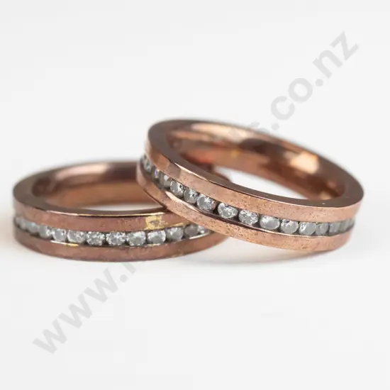 2 stainless steel rings stamped 'Spikes stainless steel'
