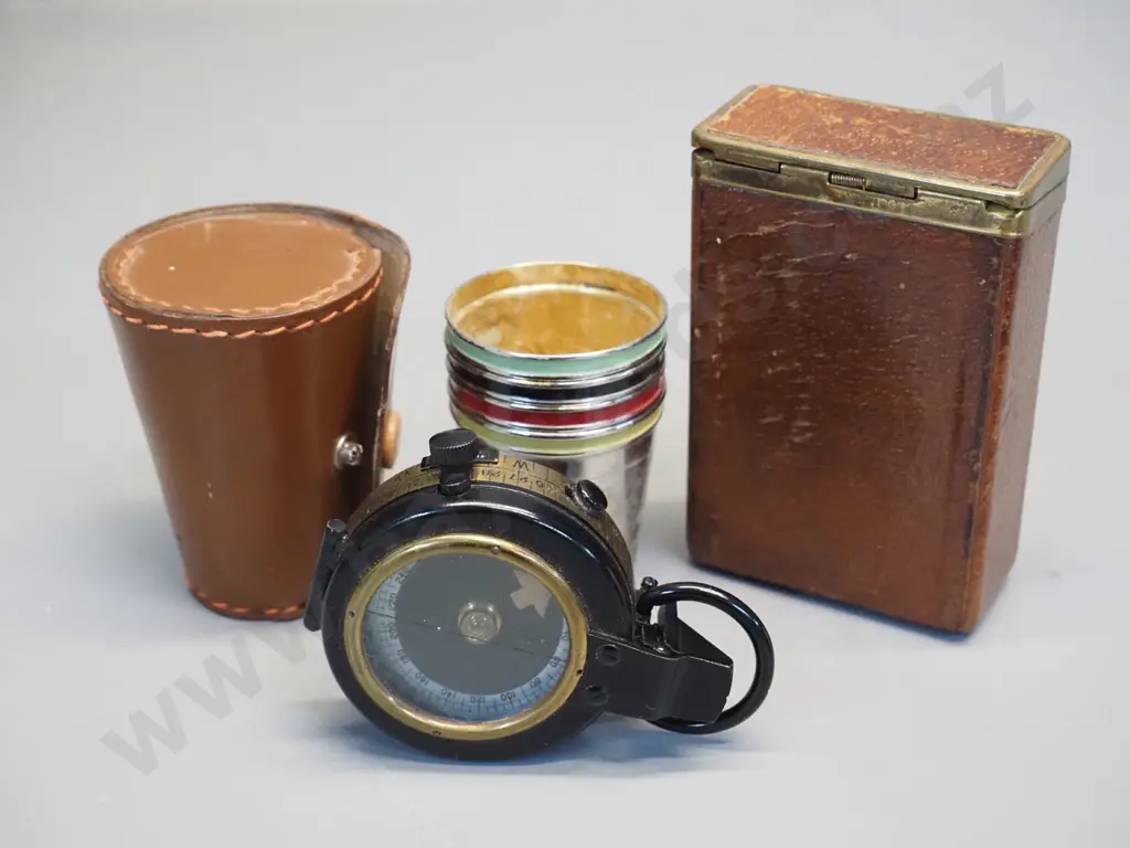 leather cased Lawrence & Mayo London prismatic service compass, a set of 4 silver plated nip cups with multi colour Image 1++