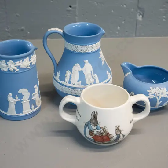 3 Wedgwood light blue Jasperware jugs and a Wedgwood Peter Rabbit double handled child's mug. Tallest jug H130