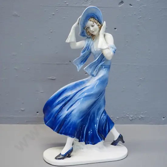 figurine of woman in the wind - H330 W190 - no maker's marks, some crazing, has had mend to base