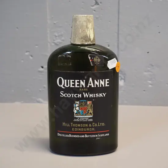 Queen Ann Rare Scotch Whisky - black label, hip flask bottle shape, with contents, seal broken H-190