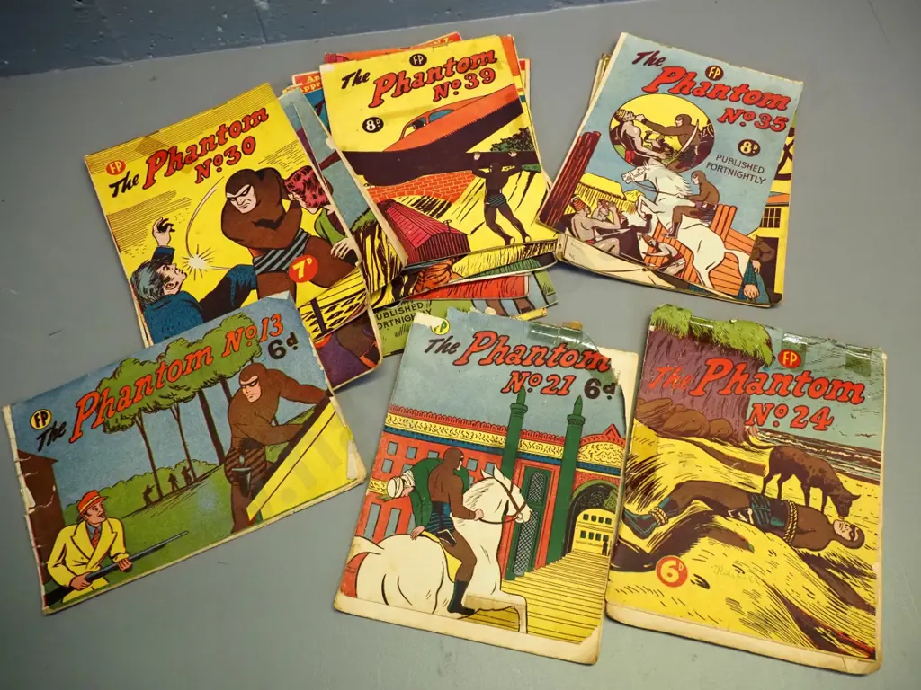 various early New Zealand issue Phantom comics - earliest is No. 13, latest is No. 50 - musty, staining and tears Image 1++
