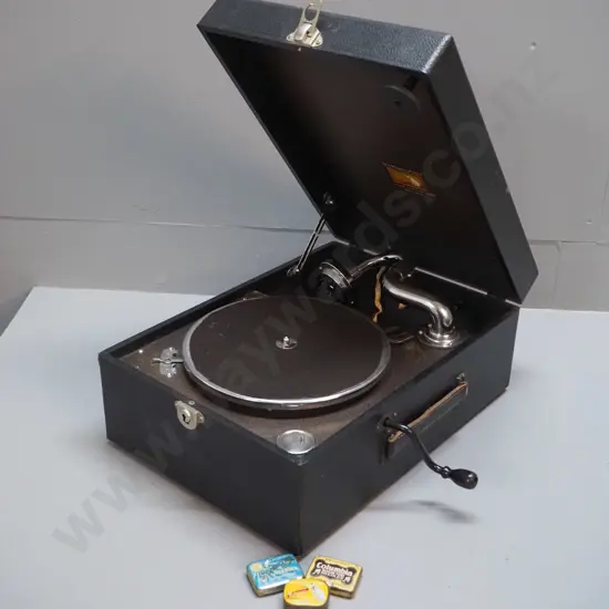 portable HMV wind-up gramophone with 3 tins of needles, working. H155 W280 D400. With cracked Slim Whitman 78