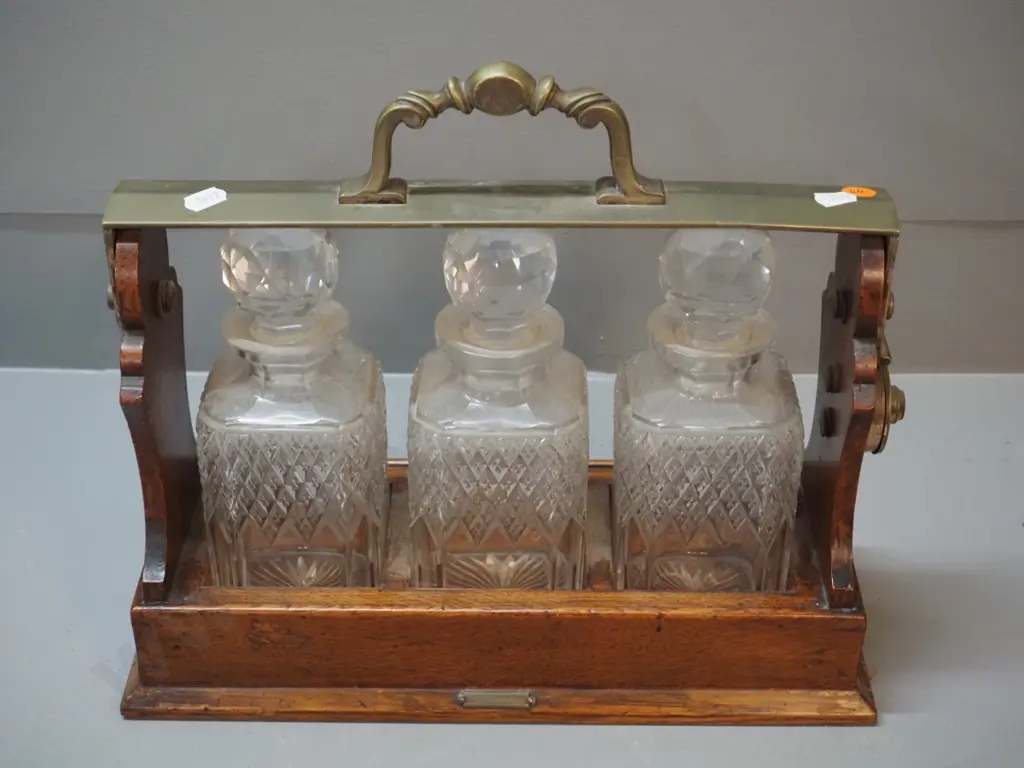 oak drinks tantalus with 3 crystal stoppered decanter, small "R. Stewart Glasgow" plaque, locked and no key Image 1++