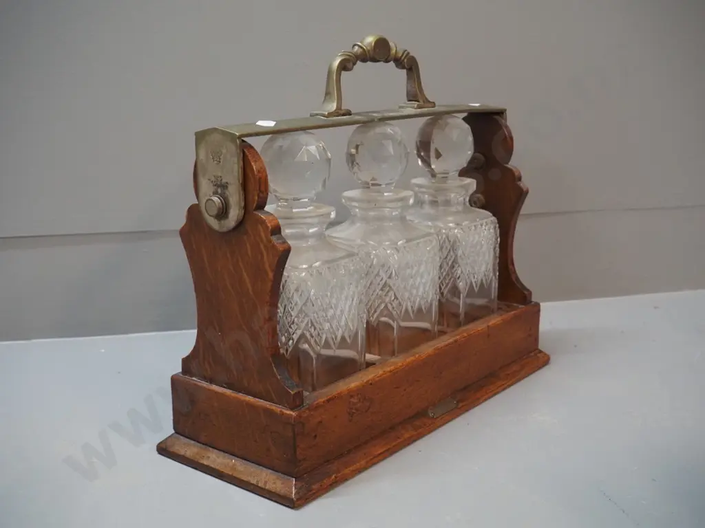 oak drinks tantalus with 3 crystal stoppered decanter, small "R. Stewart Glasgow" plaque, locked and no key Image 1++