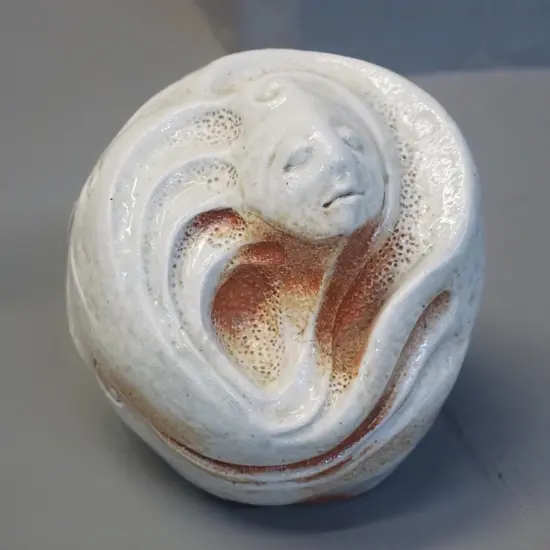 studio pottery ornament with face - potter's mark "R" and 3/100. H-110 D-110