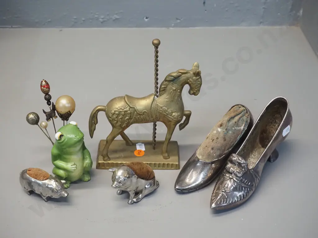 4 silver plated pin cushions, porcelain frog hat pin holder with pins and a brass carousel horse figure Image 1++