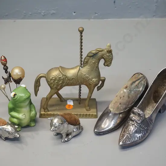 4 silver plated pin cushions, porcelain frog hat pin holder with pins and a brass carousel horse figure