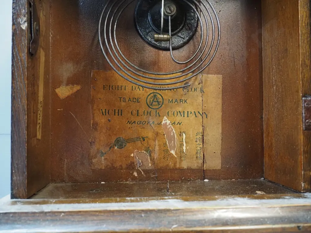 vintage arch-shaped timber-cased mantel clock with gilt patterned glass - some finish loss on face. With key & pendulum, Image 1++
