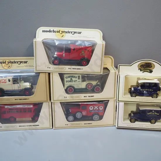5 Matchbox Models of Yesteryear model vehicles in original boxes and 2 smaller Cadbury delivery trucks