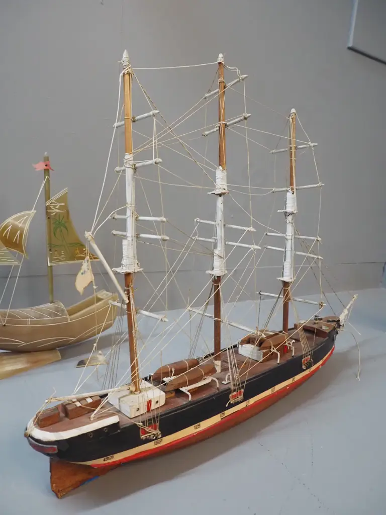 3 model ships - one horn and two timber, all with either minor damage or marking, rudder for horn ship is Image 1++