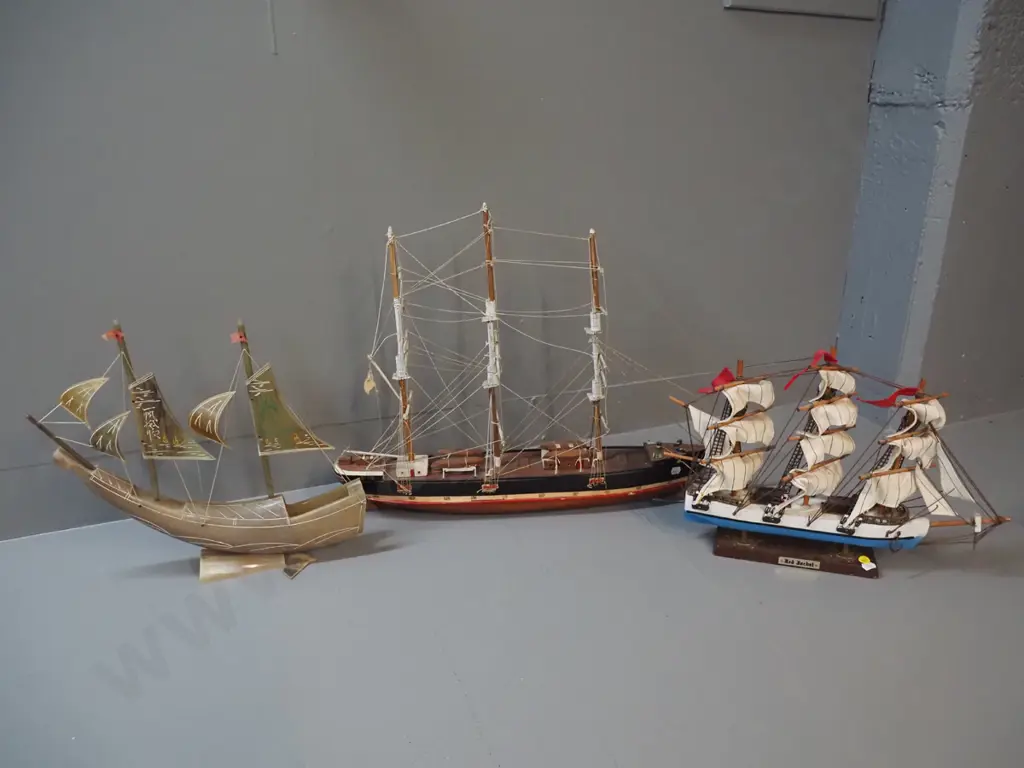 3 model ships - one horn and two timber, all with either minor damage or marking, rudder for horn ship is Image 1++