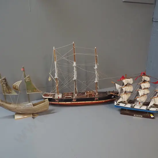 3 model ships - one horn and two timber, all with either minor damage or marking, rudder for horn ship is