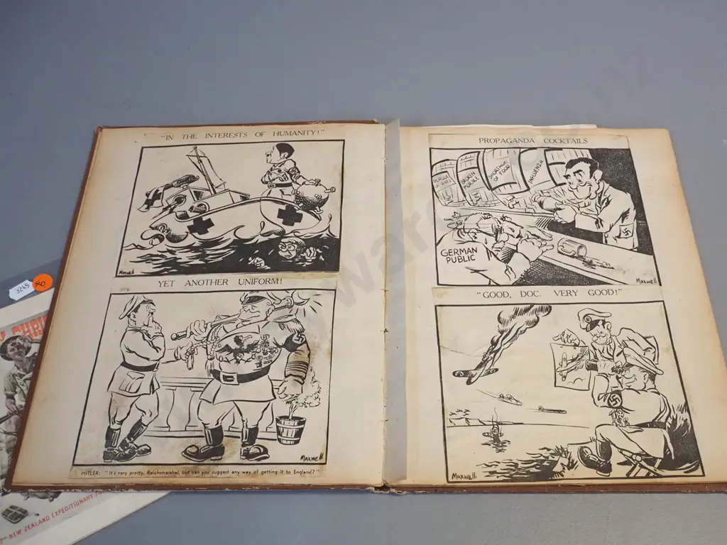 WWII era ephemera - 1941 NZEF Christmas card, 1942 field dressing and a scrapbook w/ cartoons, some foxing Image 1++