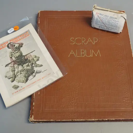 WWII era ephemera - 1941 NZEF Christmas card, 1942 field dressing and a scrapbook w/ cartoons, some foxing