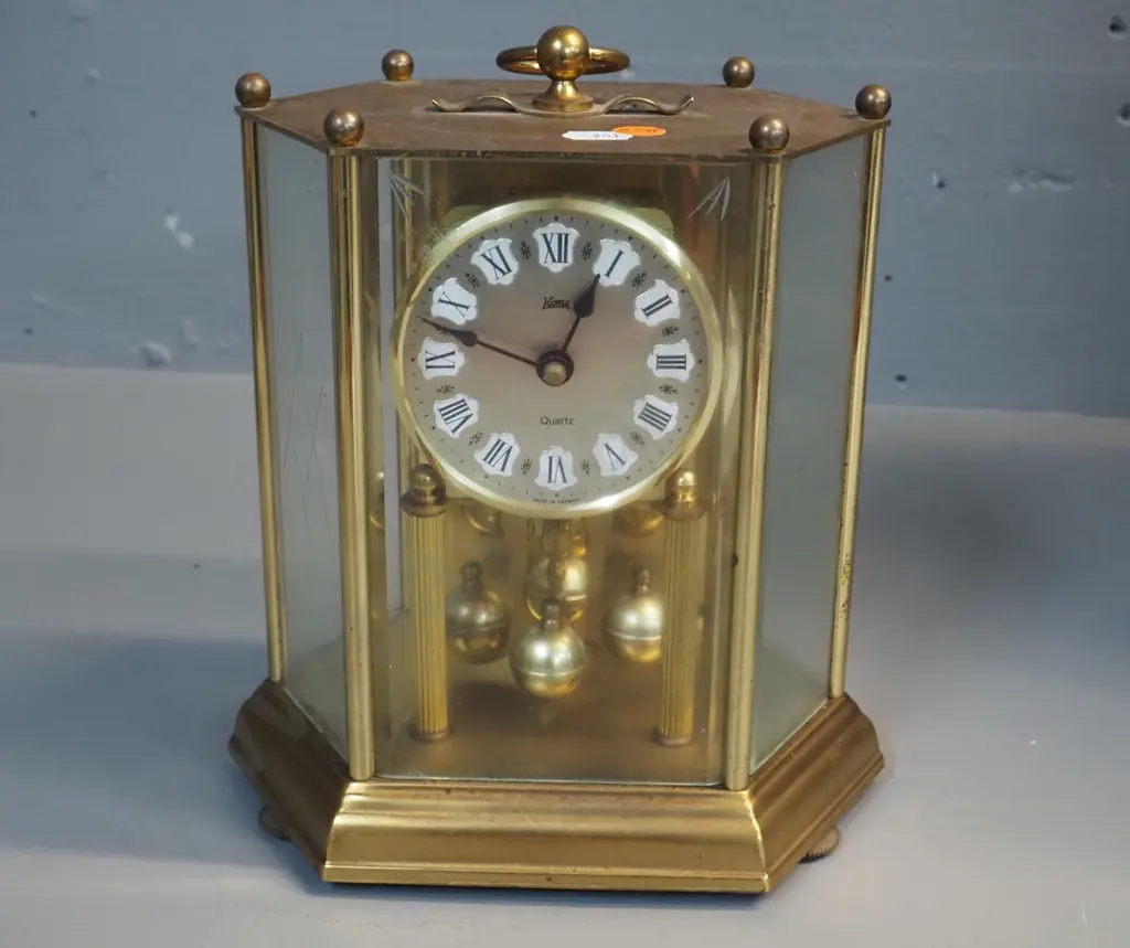 "Koma" German anniversary clock in brass and glass case, quartz movement H-230 W-200 D-130 Image 1++