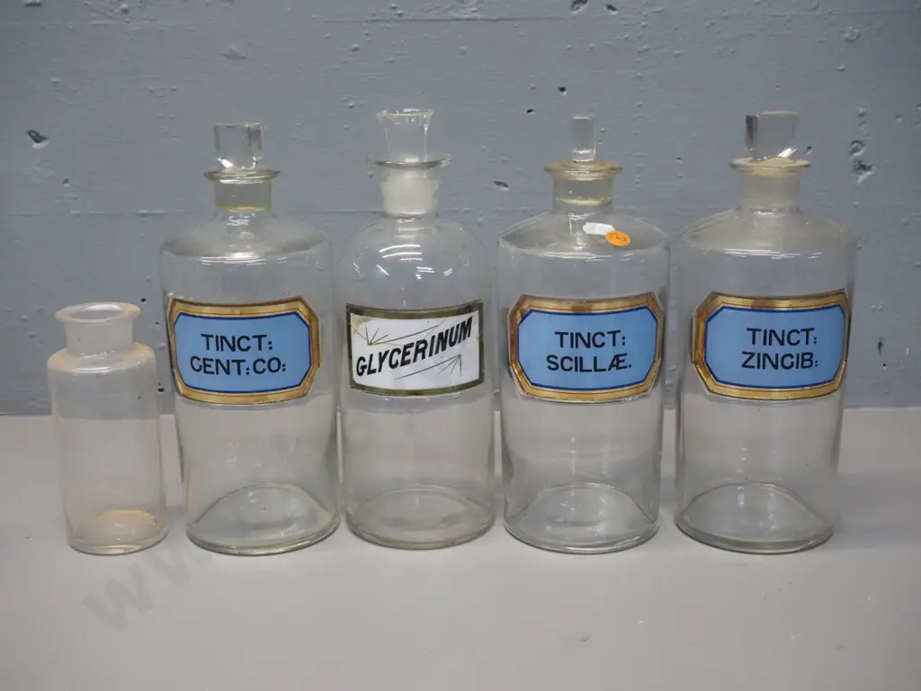 5 apothecary bottles 4 larger with labels, one has pouring insert in place of stopper, some stoppers stuck - H-250 D-100 Image 1++
