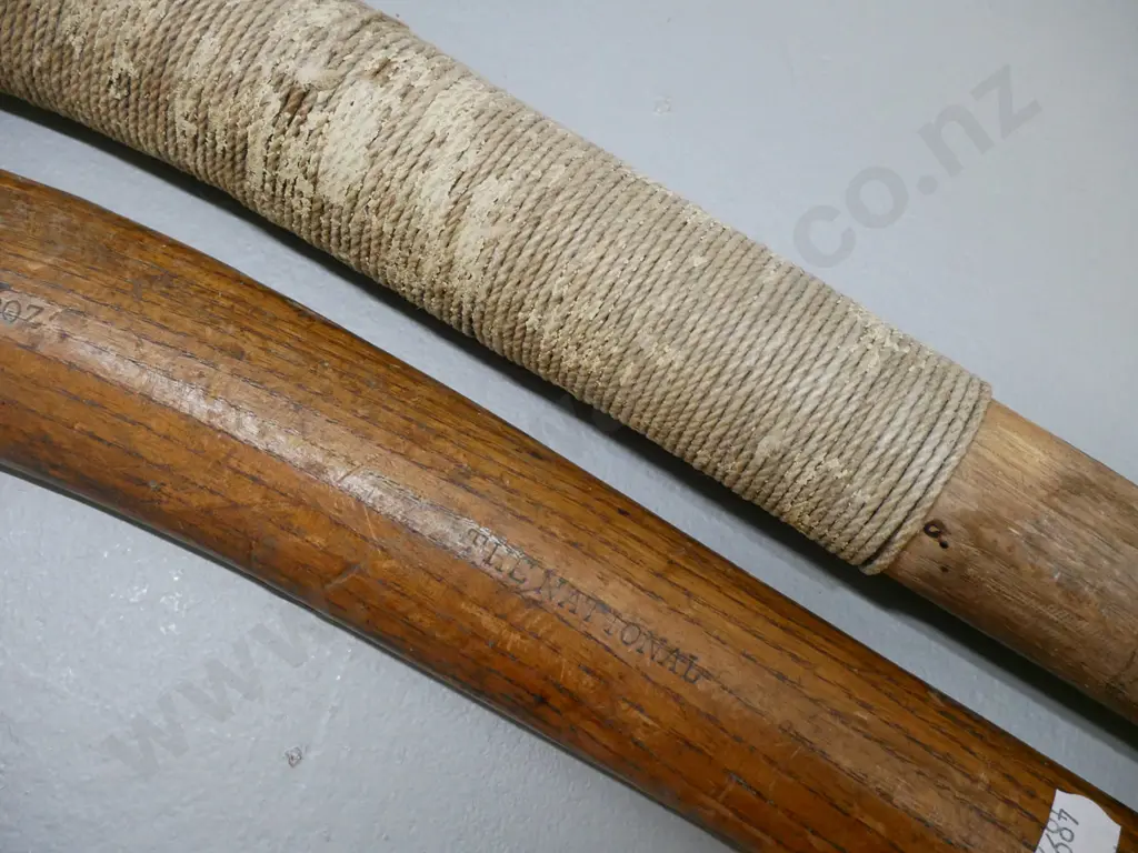 2 vintage field hockey sticks - one marked "The National" and intiials AKH L-920, some wear, other has cord binding Image 1++