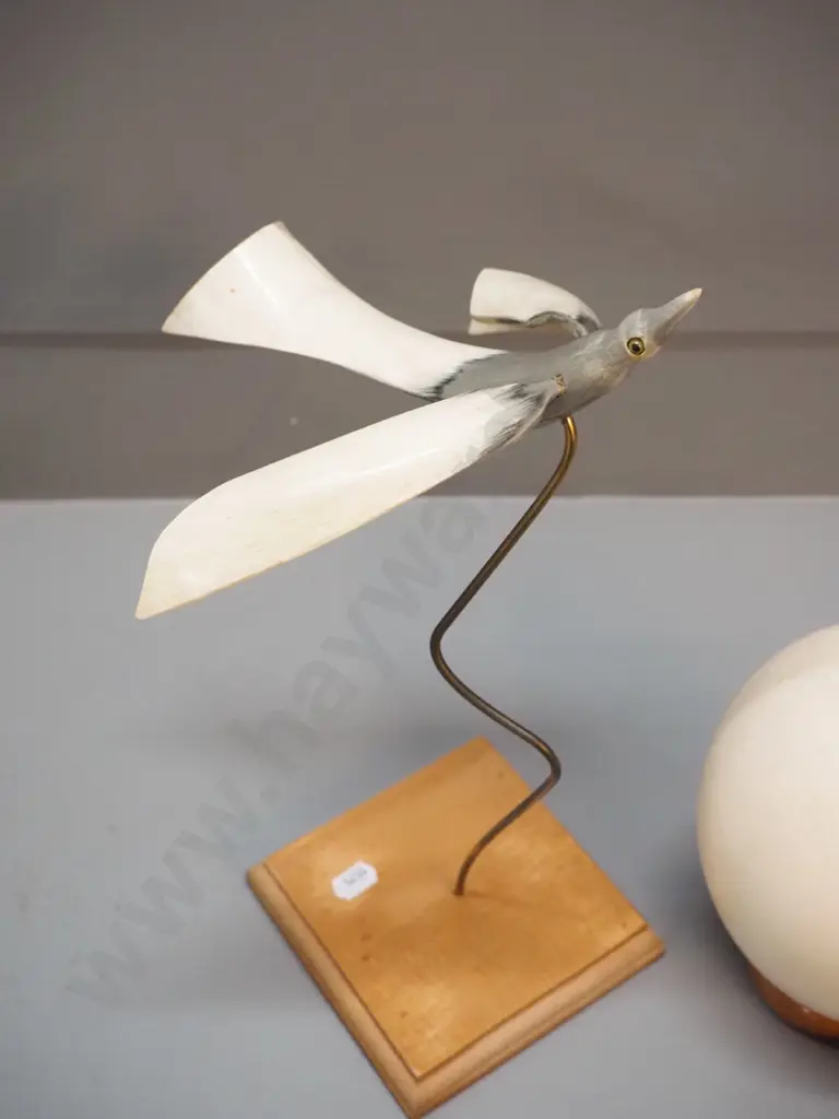 ostrich egg with wooden stand and a flying bird figure made of horn on a wooden stand H-310 Image 1++