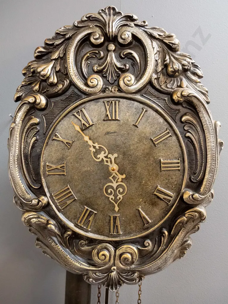 "Atlanta" West German ornate wall clock with cast metal face H-400 W-300 Image 1++