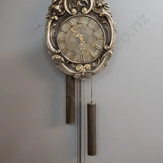 "Atlanta" West German ornate wall clock with cast metal face H-400 W-300