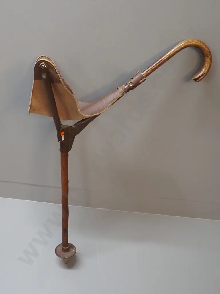 AKAH cane/seat - timber with leather triangular seat, metal and plastic fittings L-950 Image 1++