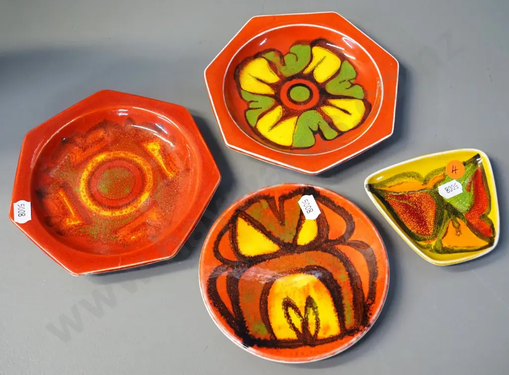 4 small signed pieces orange Poole Delphis pottery - one has mended crack, one has crack. Largest is D-145 Image 1++