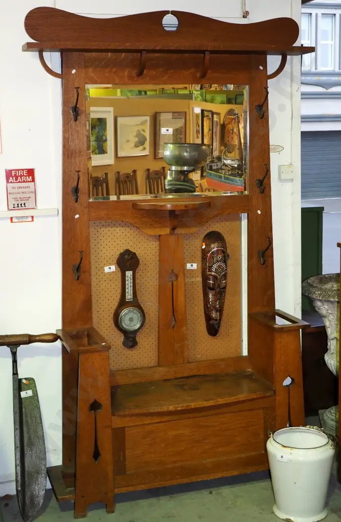 deco oak large hall stand with lift-up storage seat, 2 umbrella holders, bevelled mirror, 6 coat hooks, keyhole cutout Image 1++